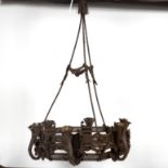 A wrought iron six-light chandelier,