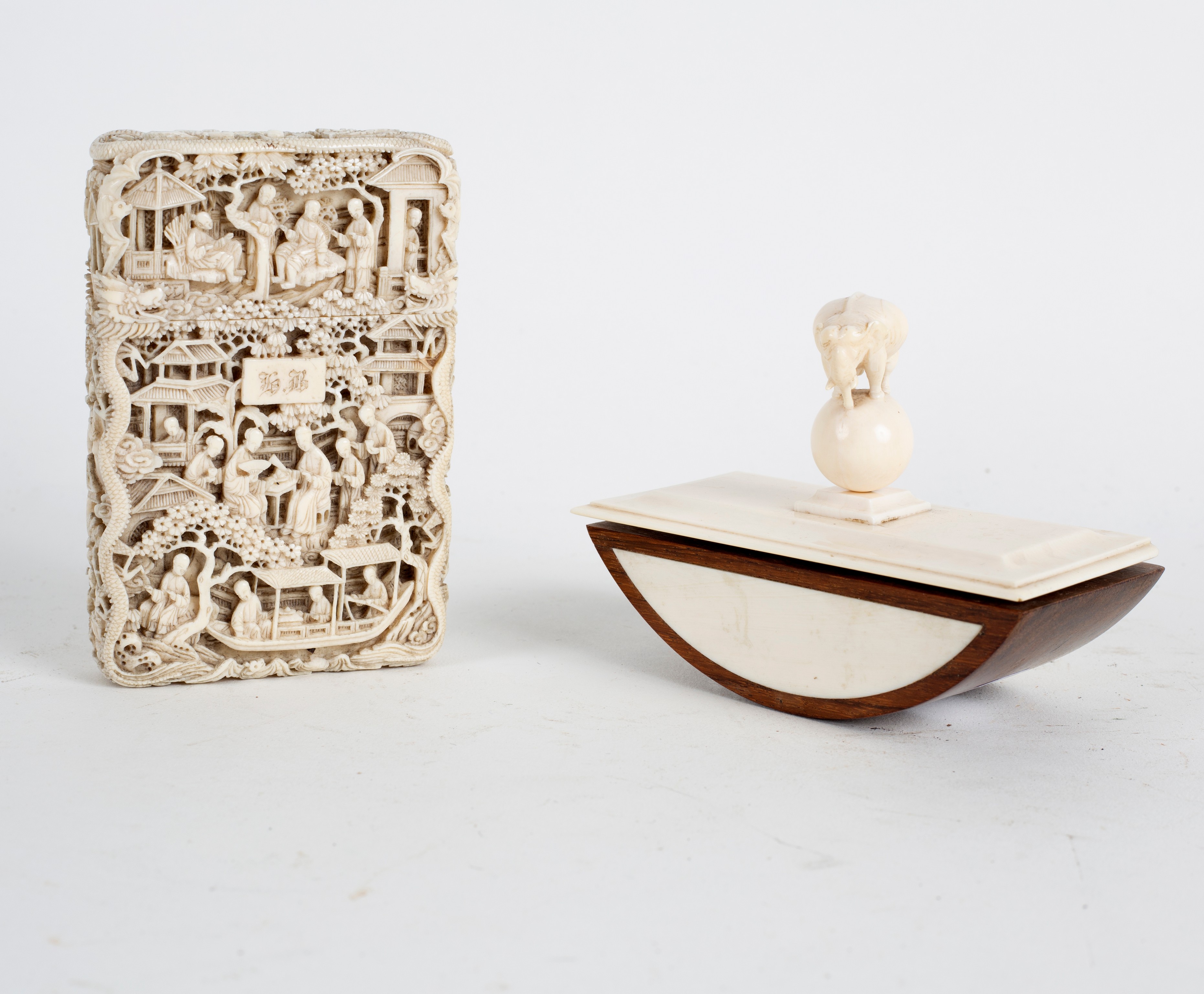 A Chinese carved ivory visiting card case with figures in buildings,