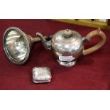 A Continental silver pill box and a Queen Anne style bullet shaped teapot (unmarked),