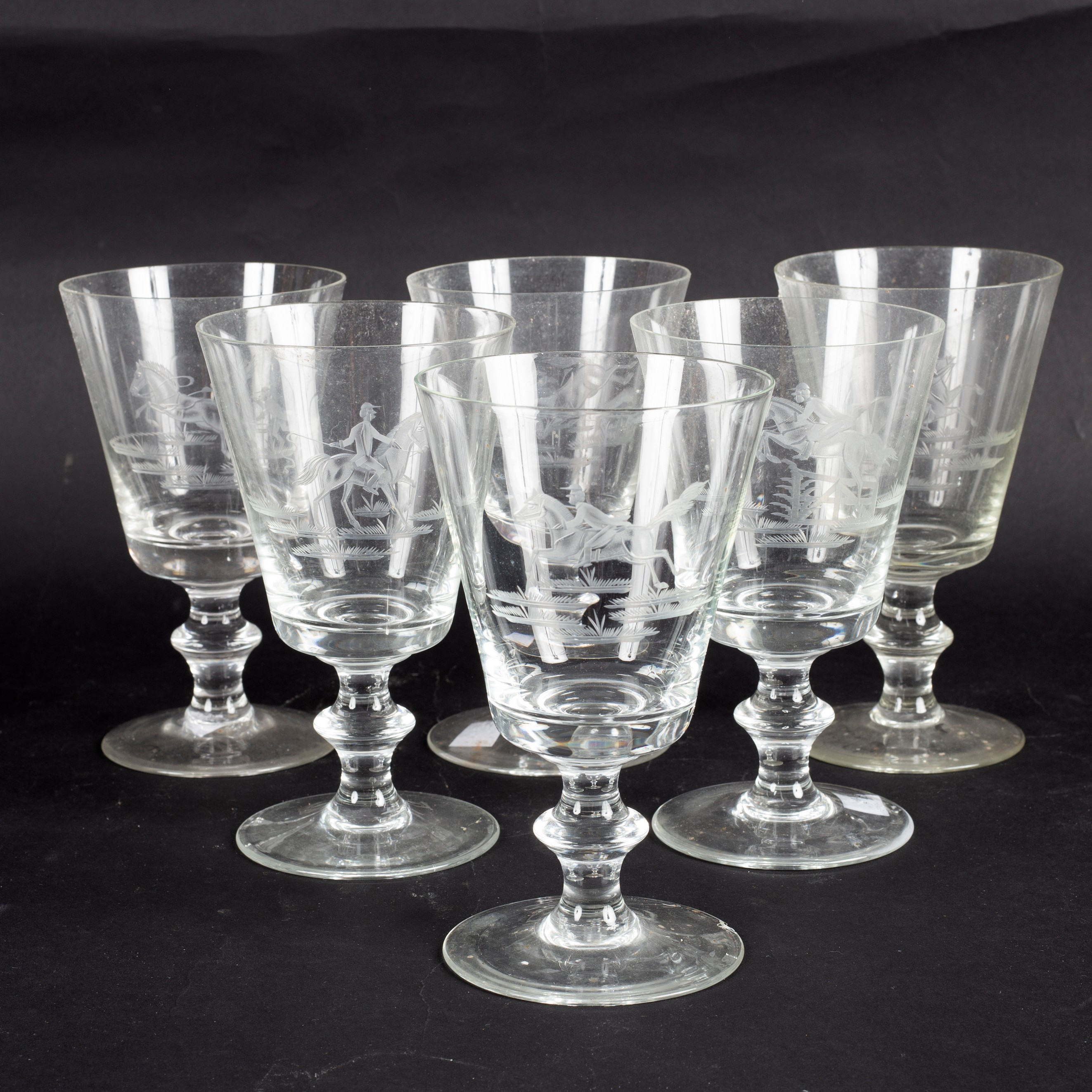 A set of six glass rummers, each with etched decoration of horsemen,