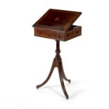 An Edwardian mahogany and inlaid reading table, the hinged top with adjustable ratchet support,