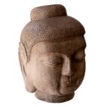 A carved stone head of Buddha,