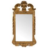 A gilt gesso framed mirror of 18th Century design, the plate 78.