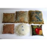 Six needlework cushions,