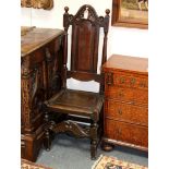 A 17th Century style high back chair with arch top and solid panel splat and seat,