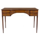 A 19th Century mahogany side table, the concave front with one long and four short drawers,