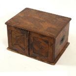 A Japanese parquetry inlaid box, Meiji period, the two doors enclosing drawers (two missing),