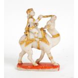 An Indian carved alabaster and gilt figure on a camel, 19th Century,