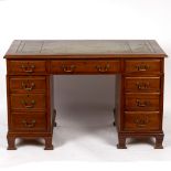 A 20th Century walnut pedestal desk, fitted three frieze drawers and three drawers to each pedestal,