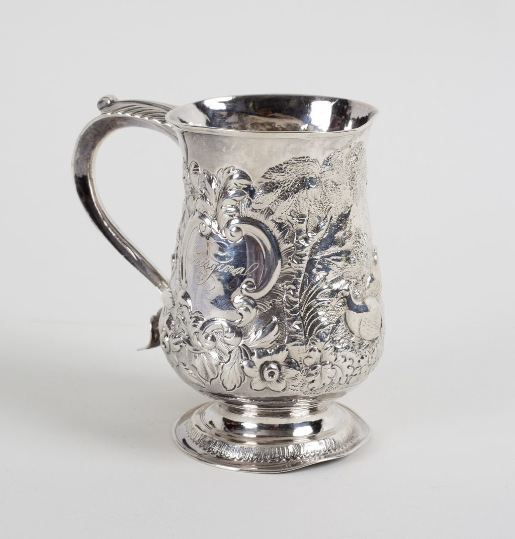 A George III silver tankard, James Smith, London 1771, later embossed a woodland scene, 12cm high,
