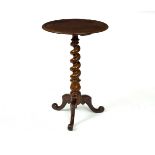 A Victorian walnut table, raised on a spiral column and tripod support, the top 47.