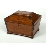 An early 19th Century satinwood work box, of sarcophagus form, banded in rosewood, 32.