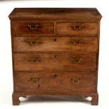 A George III mahogany chest of two short over three long drawers on bracket feet,