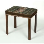 An upholstered stool on square legs,