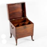 An early 19th Century mahogany wine cooler on turned legs with brass carry handles,