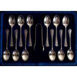 A cased set of twelve silver teaspoons and matching sugar tongs