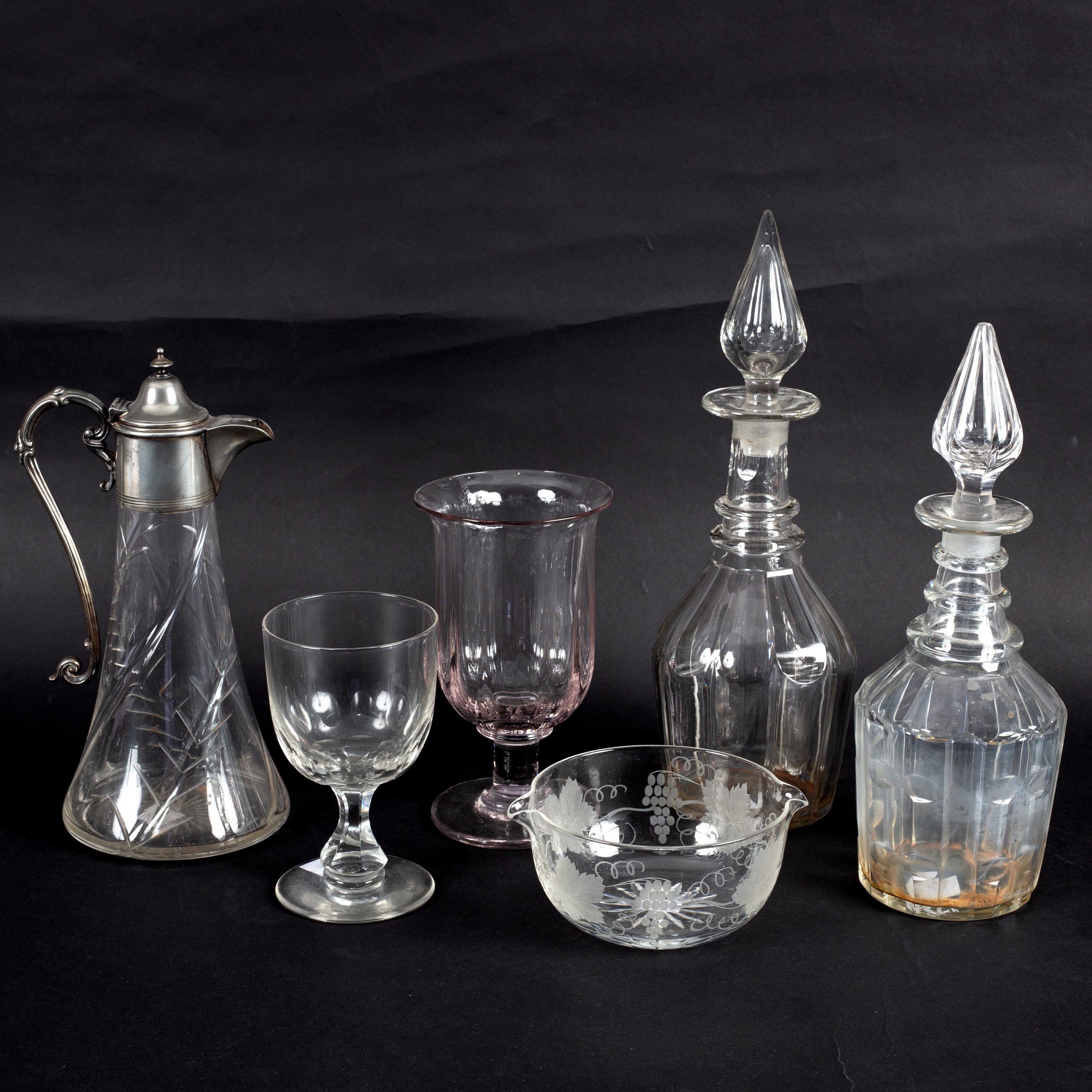 A group of 19th Century and later glass to include a plate mounted claret jug, two decanters,