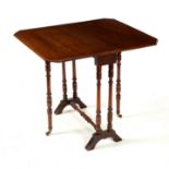 A mahogany Sutherland table on turned supports,