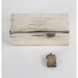 A silver cigarette box, marks rubbed, inscribed to Lieut.