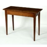 A rectangular mahogany table on square tapering legs,