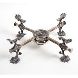 A plated dish cross with anthemion supports and burner under,