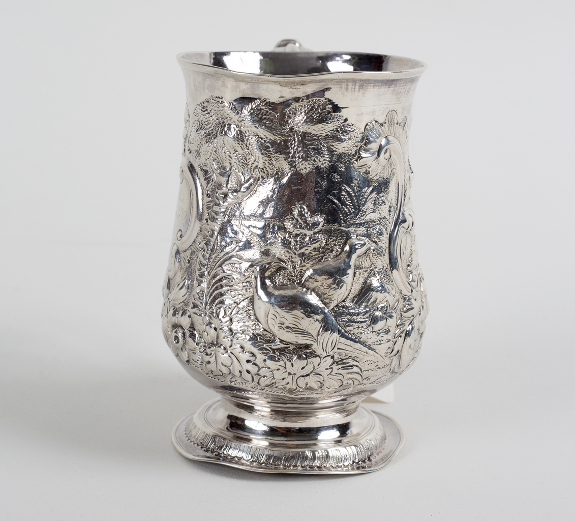 A George III silver tankard, James Smith, London 1771, later embossed a woodland scene, 12cm high, - Image 2 of 3