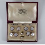 A gentleman's mother-of-pearl, enamel and pearl dress set, comprising: four buttons,