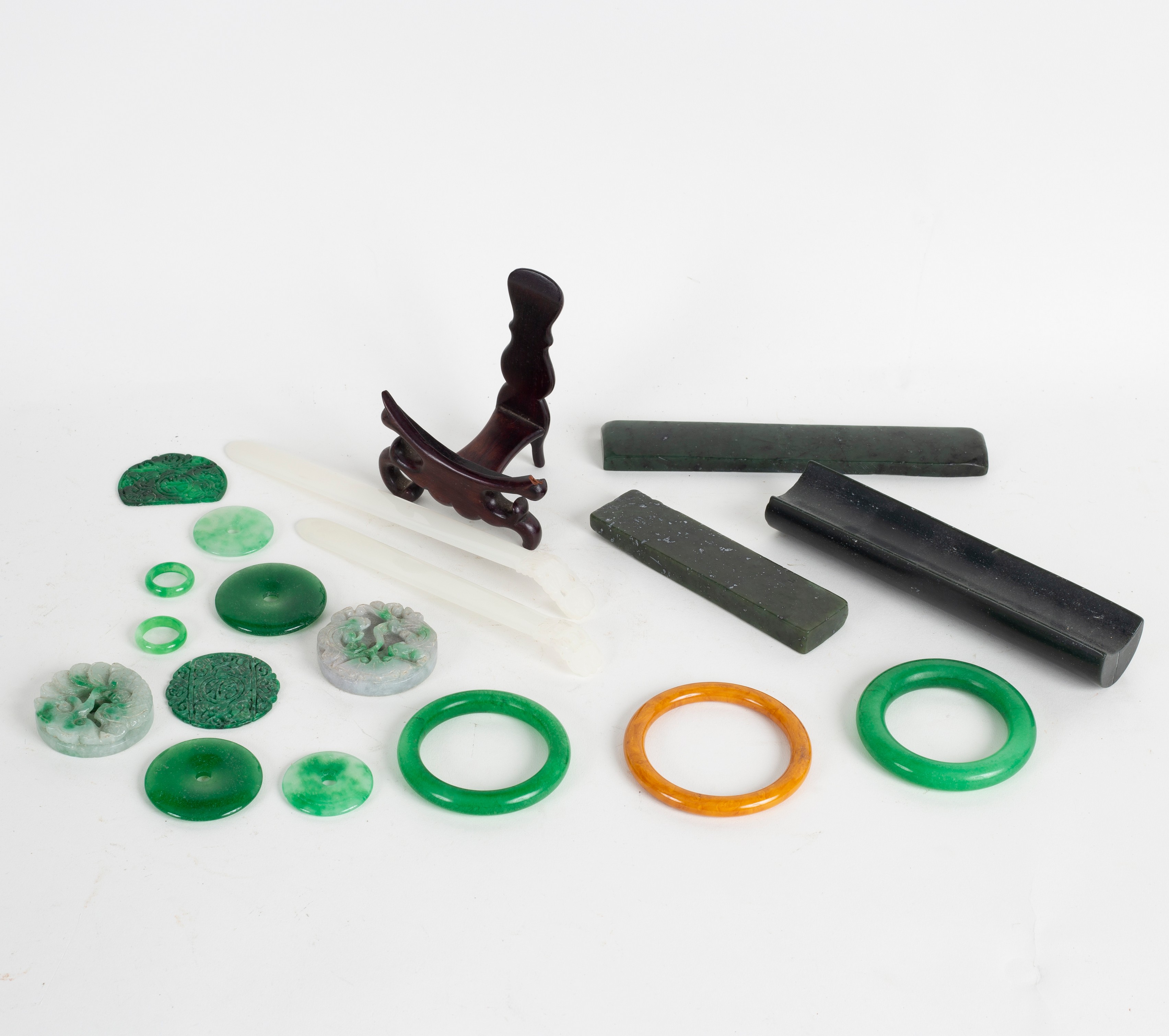 A quantity of modern Chinese jade items including rings, letter openers etc.