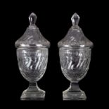 A pair of 19th Century cut glass bonbon vases and covers,