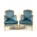 A pair of armchairs with painted moulded frames