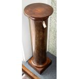 A mahogany and palm wood pedestal, 99.