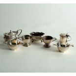 A pair of silver salts of miniature porringer form, two small trophy cups,