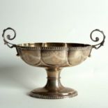 A silver oval octofoil pedestal dish, Birmingham 1908, engraved swags and ribbon ties,