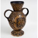 A Gothic revival two-handled vase, decorated an armorial and motto to each side, 45.