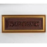 An Indian carved hardwood panel depicting exotic birds and mythological beasts, 26cm x 77cm,