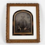 A 19th Century ambrotype portrait of a man highlighted in gilt,