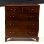 A George III oak and crossbanded chest of two short over three long drawers, on bracket feet, 108.