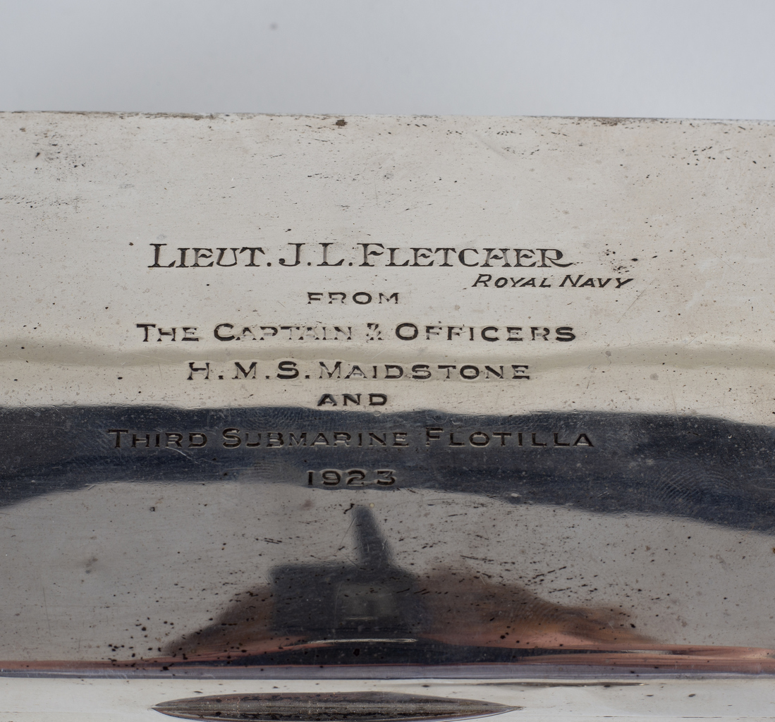 A silver cigarette box, marks rubbed, inscribed to Lieut. - Image 2 of 2