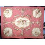 A 19th Century wall hanging in the Aubusson style, decorated floral sprays and scrolls,