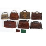 A crocodile skin dressing case with fitted interior (fittings lacking), the covers initialled JHP,