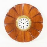 A Sestrel wall clock, the dial with Roman numerals set in a mahogany frame of flowerhead design,
