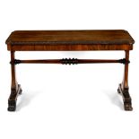 A late Regency rosewood library table, circa 1825, the rectangular top with a heavy beaded border,