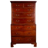 A George III mahogany chest on chest with dentil frieze above two short and three long drawers