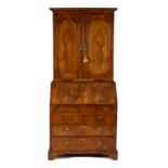 A George I walnut and herringbone banded bureau bookcase,