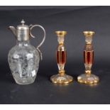 An etched glass claret jug with plated mounts, decorated branches and butterflies,