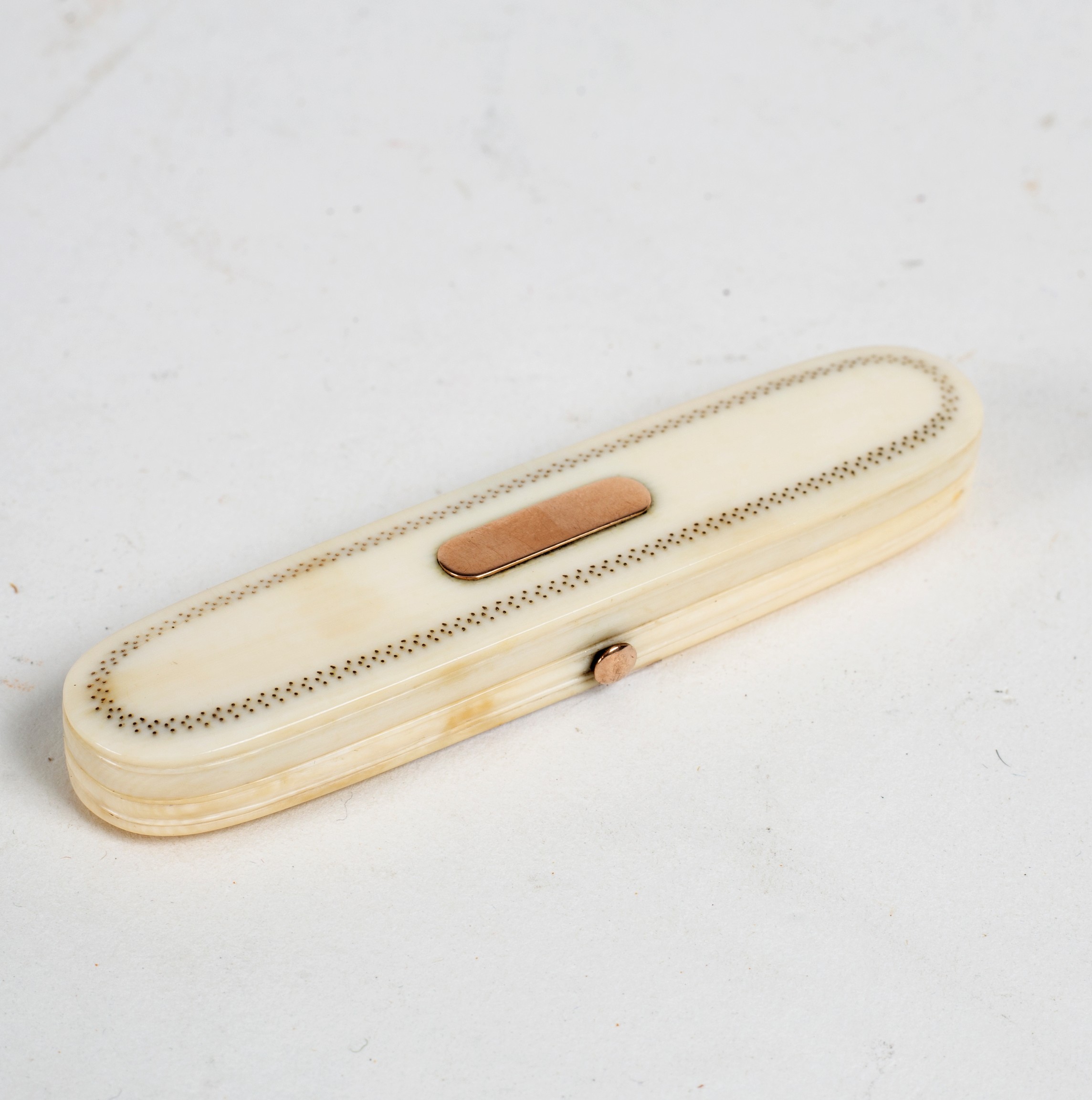 A Georgian ivory toothpick holder, the cover fitted a mirror,