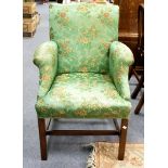 An upholstered armchair on square chamfered legs