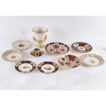 A collection of eight English porcelain plates, a Derby coffee can,