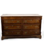 An early 19th Century oak and fruitwood banded blanket chest with hinged top,