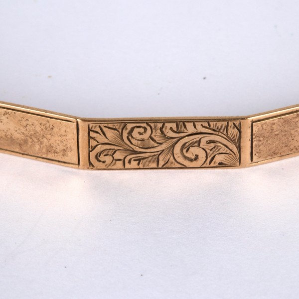 A 9ct gold arm bangle, of polygonal shape with alternate plain and engraved panels, - Image 2 of 2